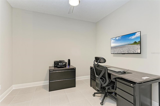 home office featuring a textured ceiling and light tile patterned floors