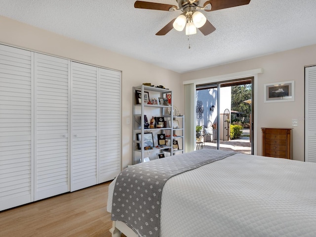 bedroom featuring access to outside, a textured ceiling, a closet, ceiling fan, and light hardwood / wood-style floors