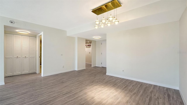 unfurnished room with hardwood / wood-style floors