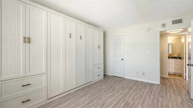 unfurnished bedroom with light hardwood / wood-style flooring