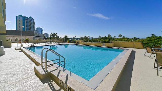 view of swimming pool with a patio area