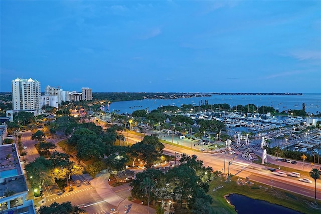 birds eye view of property featuring a water view