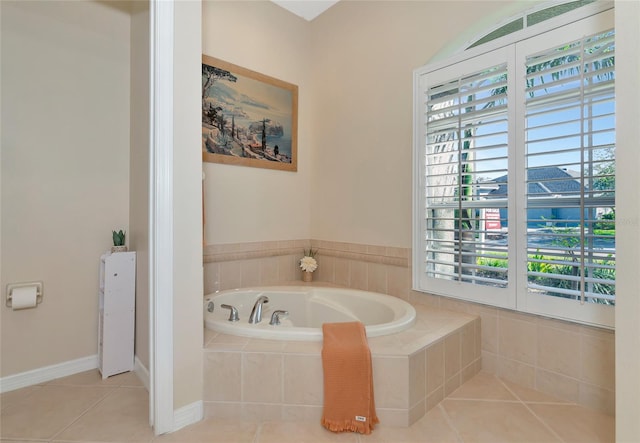 bathroom featuring tile patterned floors and tiled tub