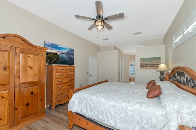 bedroom with light wood-type flooring and ceiling fan