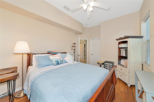 bedroom with hardwood / wood-style floors and ceiling fan