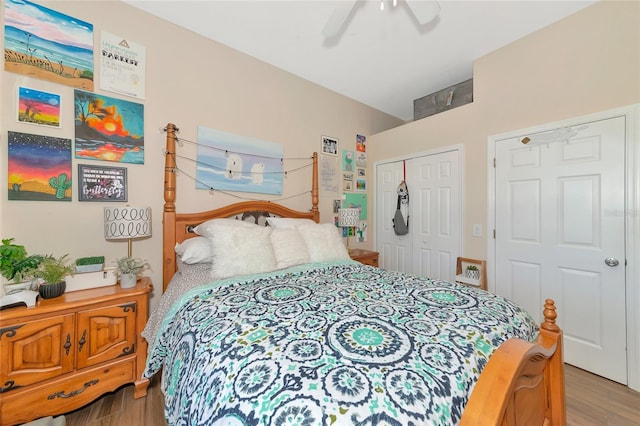 bedroom featuring hardwood / wood-style flooring, a closet, and ceiling fan