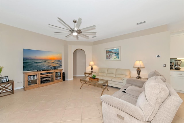 living room featuring light tile patterned flooring and ceiling fan