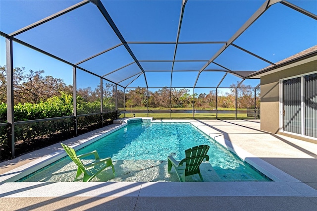 view of swimming pool featuring a patio area and glass enclosure