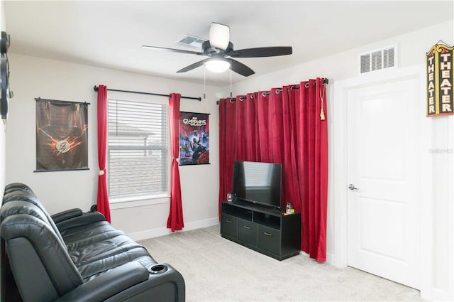 living room with light carpet and ceiling fan