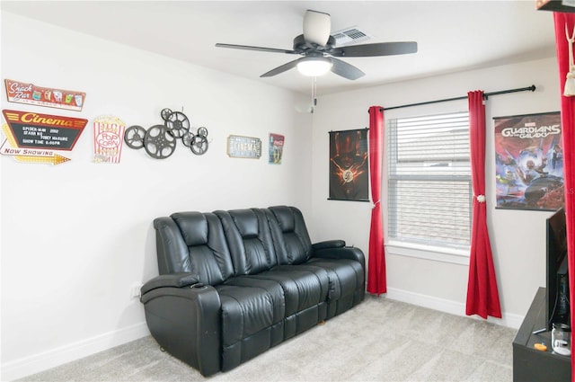 living room with light colored carpet and ceiling fan