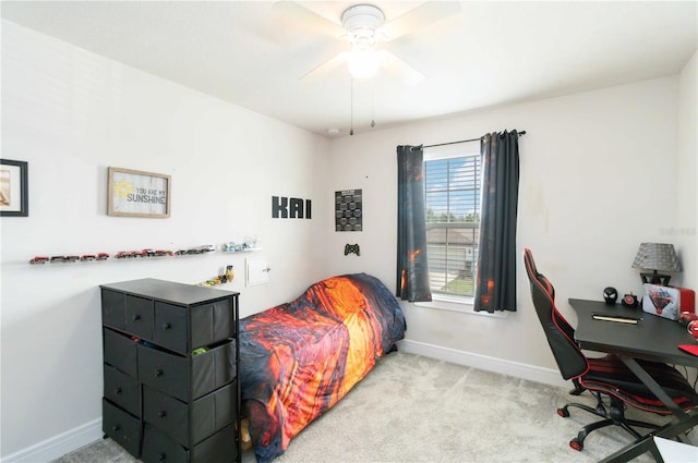 bedroom with ceiling fan and light colored carpet