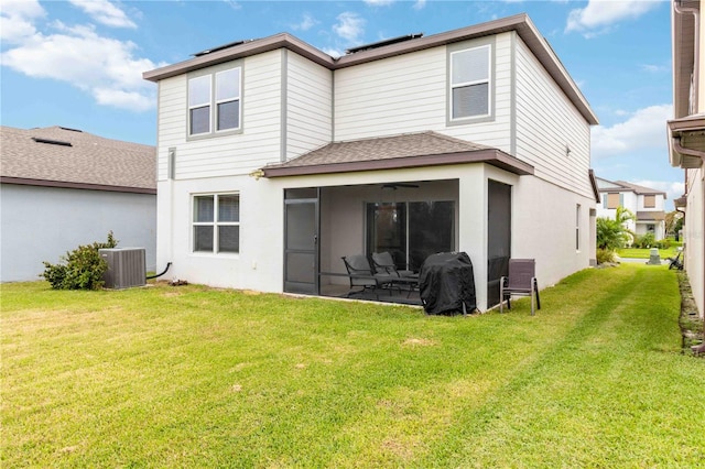 rear view of property with a yard, a patio area, and central air condition unit