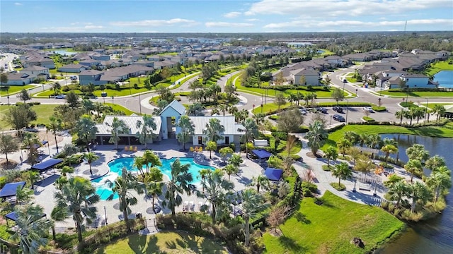 birds eye view of property with a water view