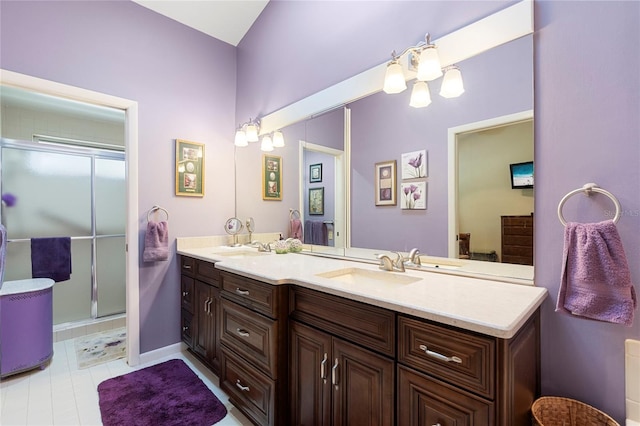 bathroom with vanity and a shower with shower door