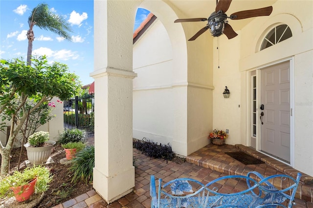 entrance to property with ceiling fan