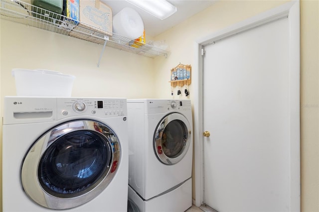 washroom with independent washer and dryer