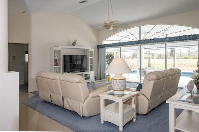 living room with ceiling fan and vaulted ceiling