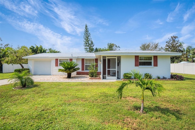 single story home featuring a front lawn and a garage