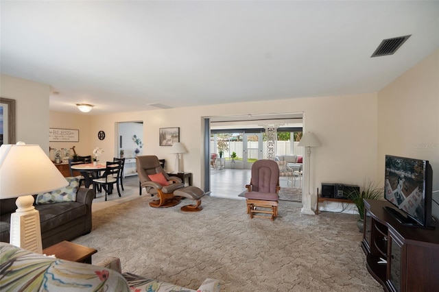 living room featuring light colored carpet