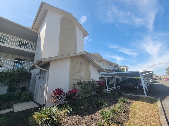 view of home's exterior featuring a balcony