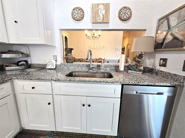 kitchen featuring sink, stainless steel dishwasher, and white cabinets