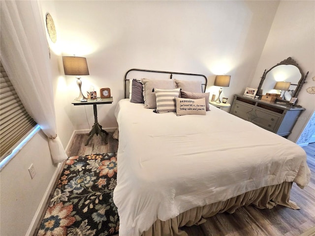 bedroom featuring wood-type flooring