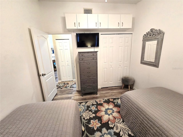 bedroom featuring dark hardwood / wood-style flooring