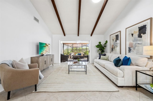 living room with vaulted ceiling with beams and light tile patterned floors