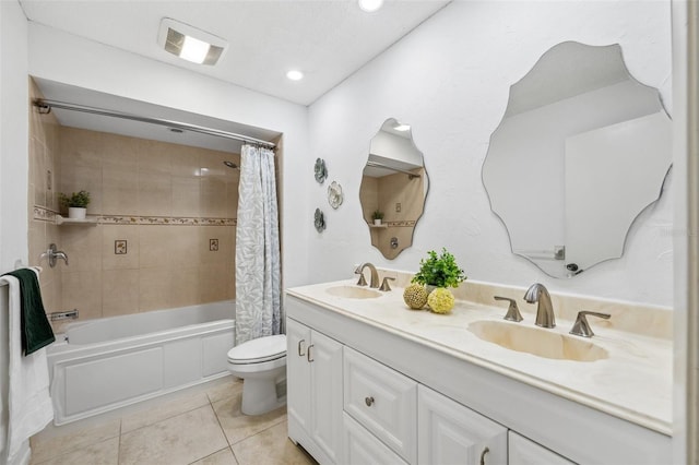 full bathroom featuring vanity, shower / bath combo with shower curtain, toilet, and tile patterned flooring