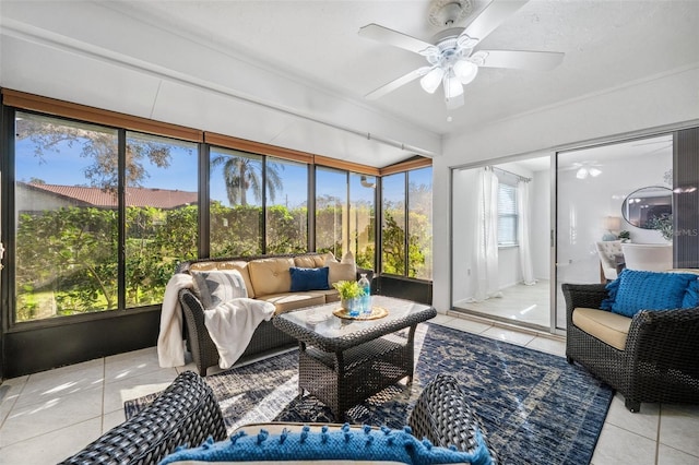 sunroom featuring ceiling fan and a healthy amount of sunlight