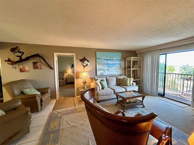 carpeted living room featuring a textured ceiling