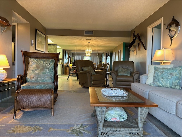 carpeted living room with a textured ceiling