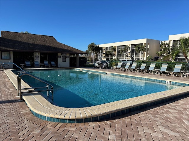 view of swimming pool featuring a patio area