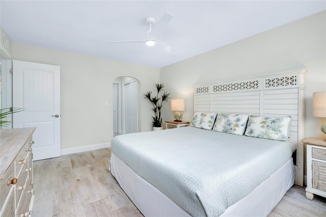 bedroom with light hardwood / wood-style flooring and ceiling fan