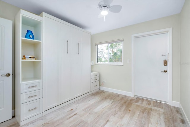 unfurnished bedroom featuring light wood-type flooring and ceiling fan