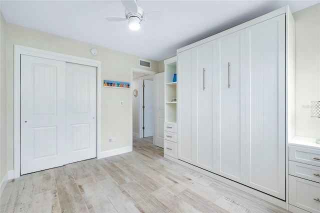 unfurnished bedroom featuring a closet, ceiling fan, and light hardwood / wood-style floors