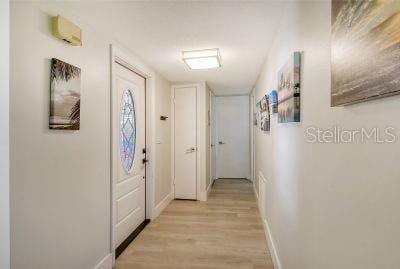 corridor featuring light hardwood / wood-style floors