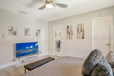 bedroom featuring ceiling fan and wood-type flooring