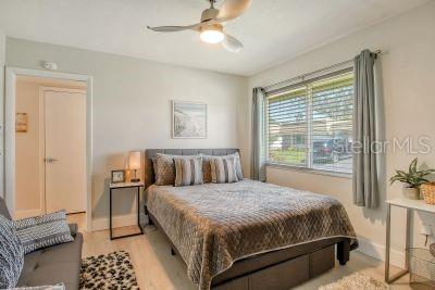 bedroom featuring light wood-type flooring and ceiling fan