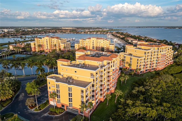 birds eye view of property with a water view