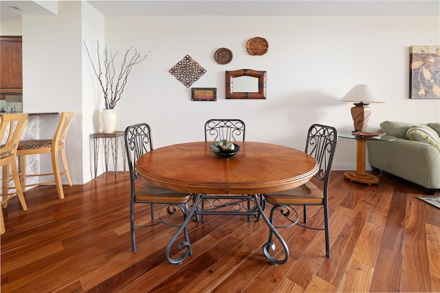 dining area with hardwood / wood-style flooring