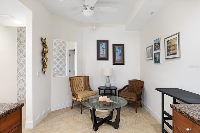 sitting room with light tile patterned floors and ceiling fan