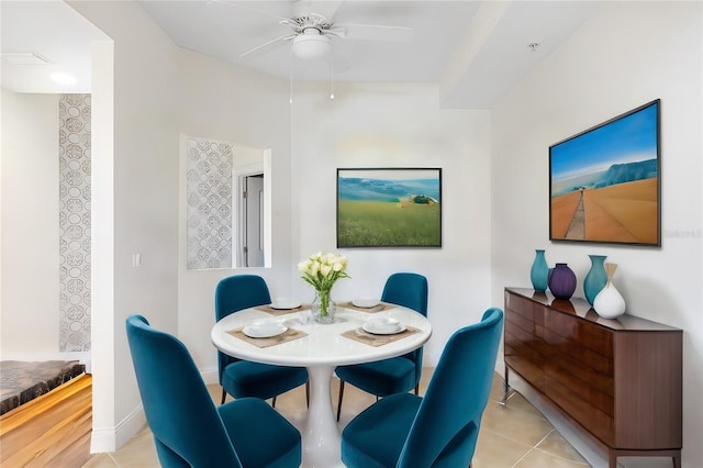 dining space featuring light wood-type flooring and ceiling fan