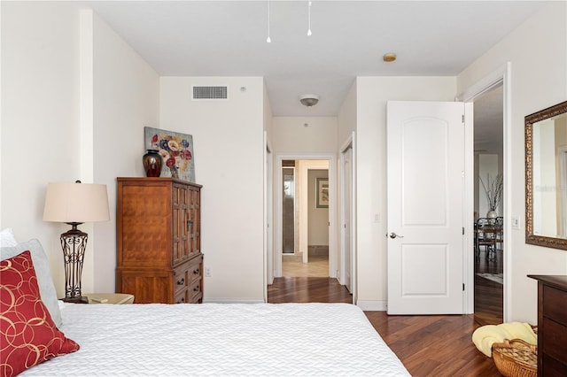 bedroom featuring dark hardwood / wood-style flooring