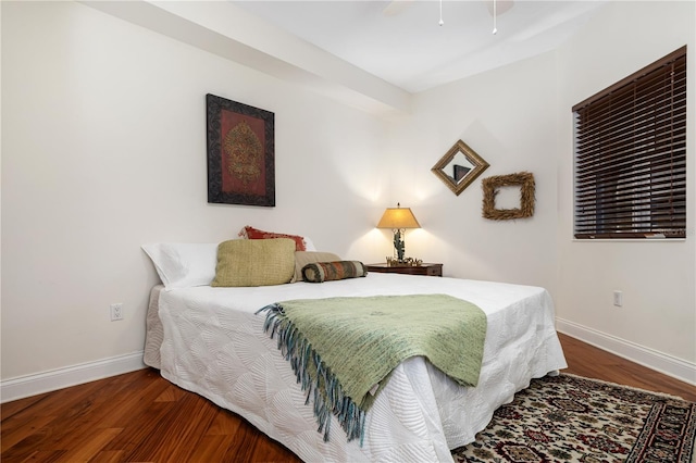 bedroom with dark hardwood / wood-style floors and ceiling fan