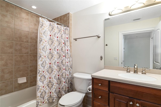 full bathroom featuring vanity, toilet, and shower / bath combination with curtain