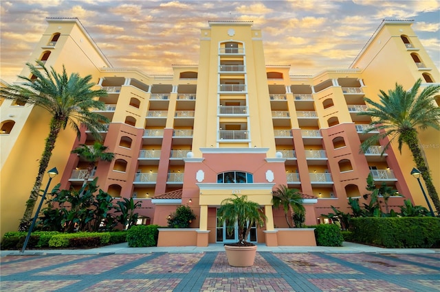 view of outdoor building at dusk