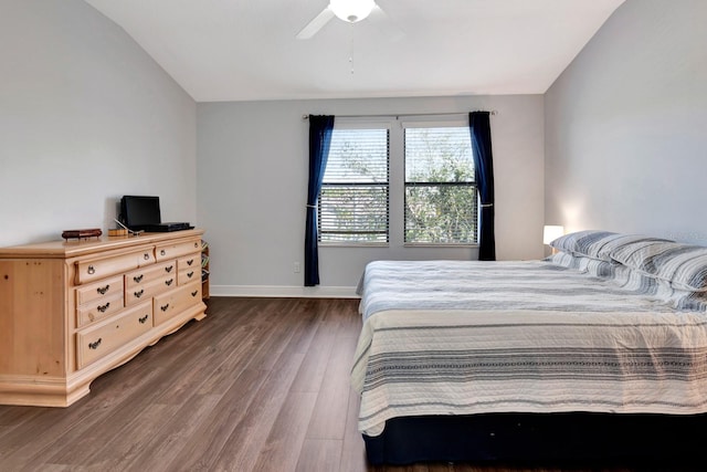 bedroom with ceiling fan and dark hardwood / wood-style flooring