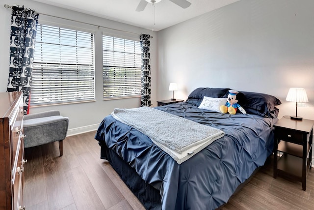 bedroom featuring hardwood / wood-style floors and ceiling fan