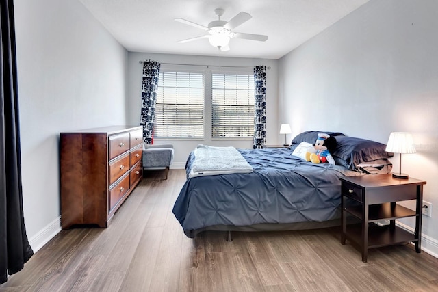 bedroom featuring hardwood / wood-style floors and ceiling fan